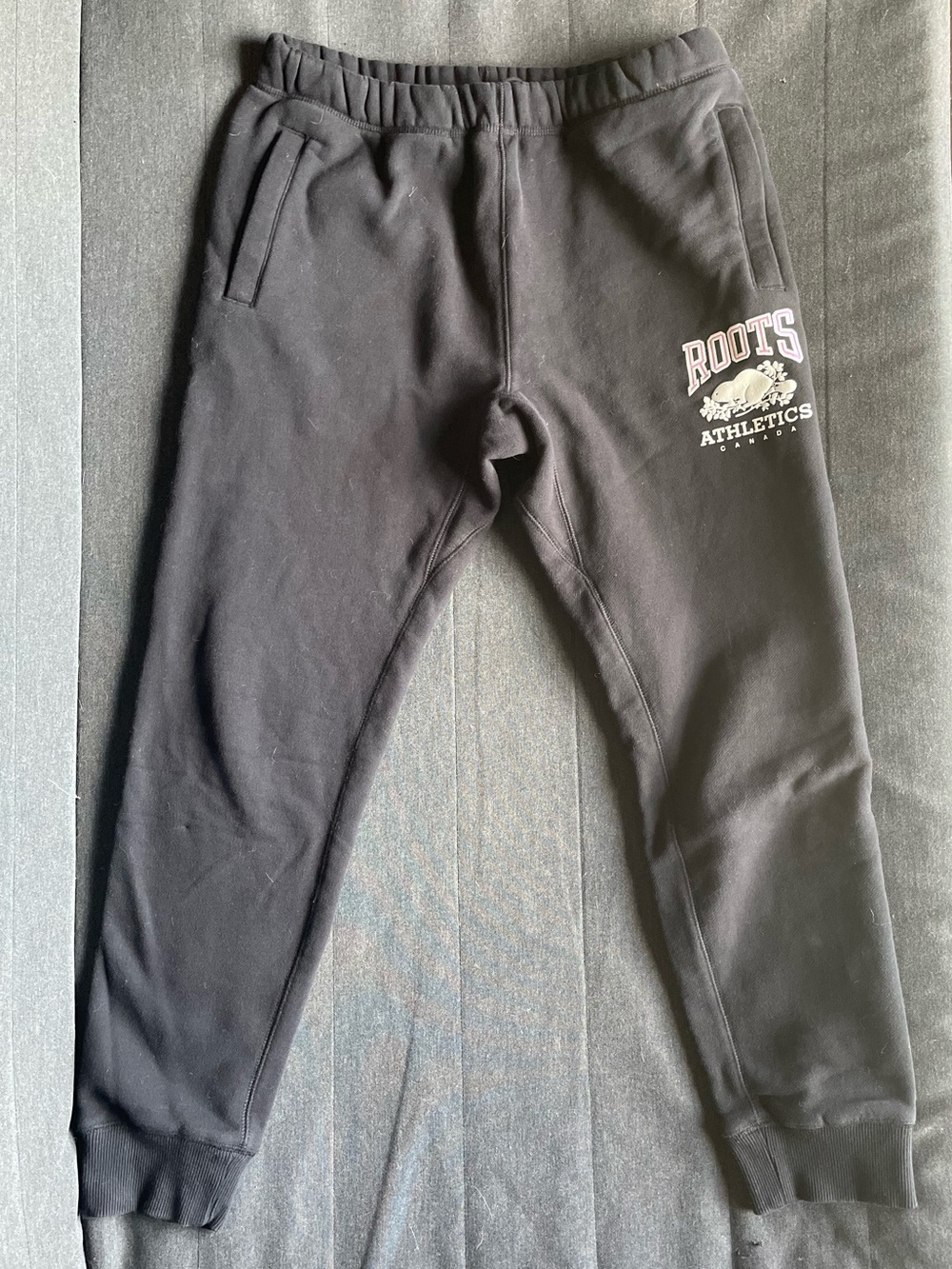 Roots Athletics black women’s sweatpants with logo zip pockets size small